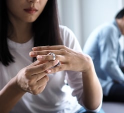 Woman Looking At A Ring On Her Finger