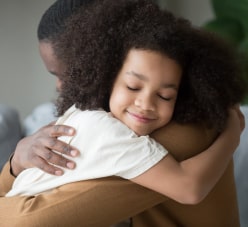 Child Hugging His Father