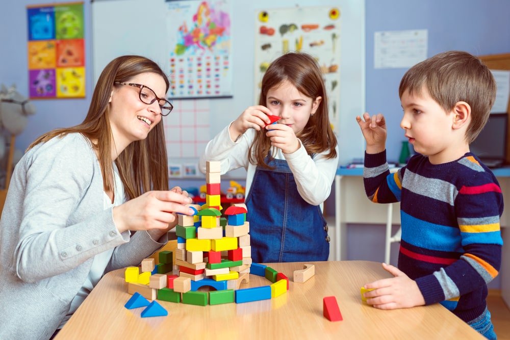 Legos Woman And Two Children Building Legos