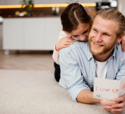 Child On The Back Of Her Father