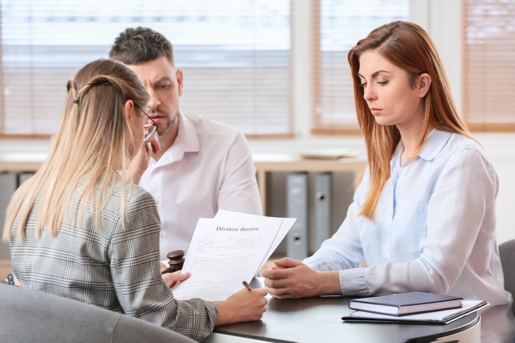 Young couple visiting divorce lawyer at office